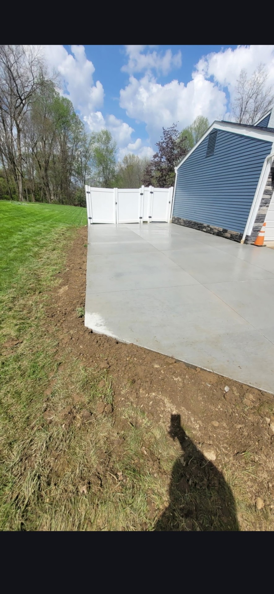 Concrete pad along fence line