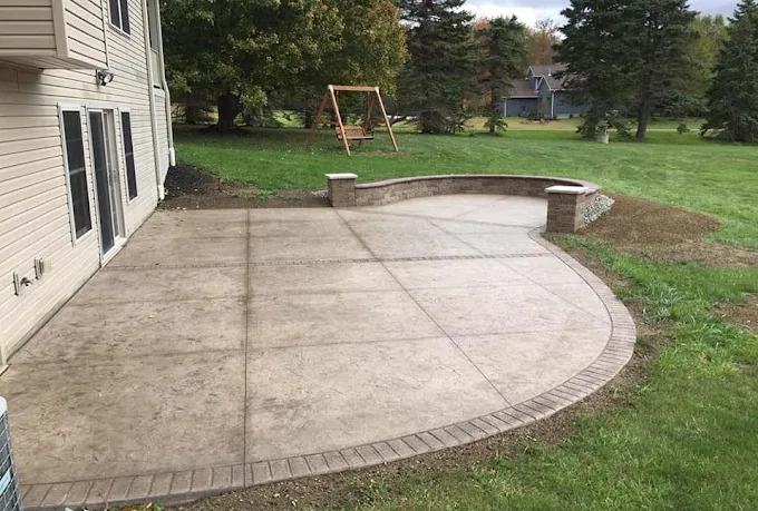 Stamped concrete patio with seat wall